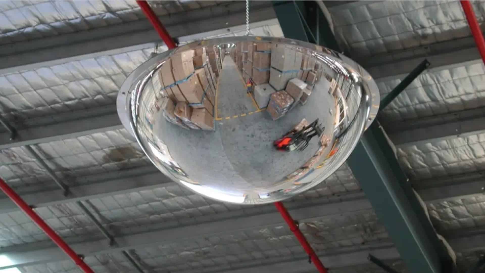 large full dome mirror hanging in warehouse office