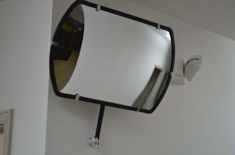 rountangular convex mirror mounted near low ceiling
